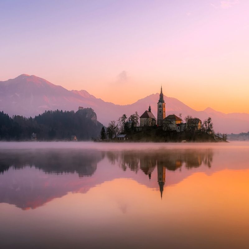 Calm sunrise over a still lake with gentle reflections, symbolizing the shift from calm to crazy.