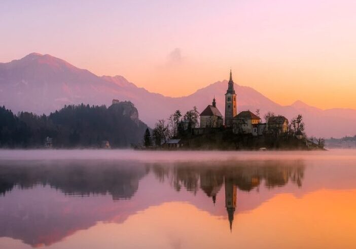 Calm sunrise over a still lake with gentle reflections, symbolizing the shift from calm to crazy.